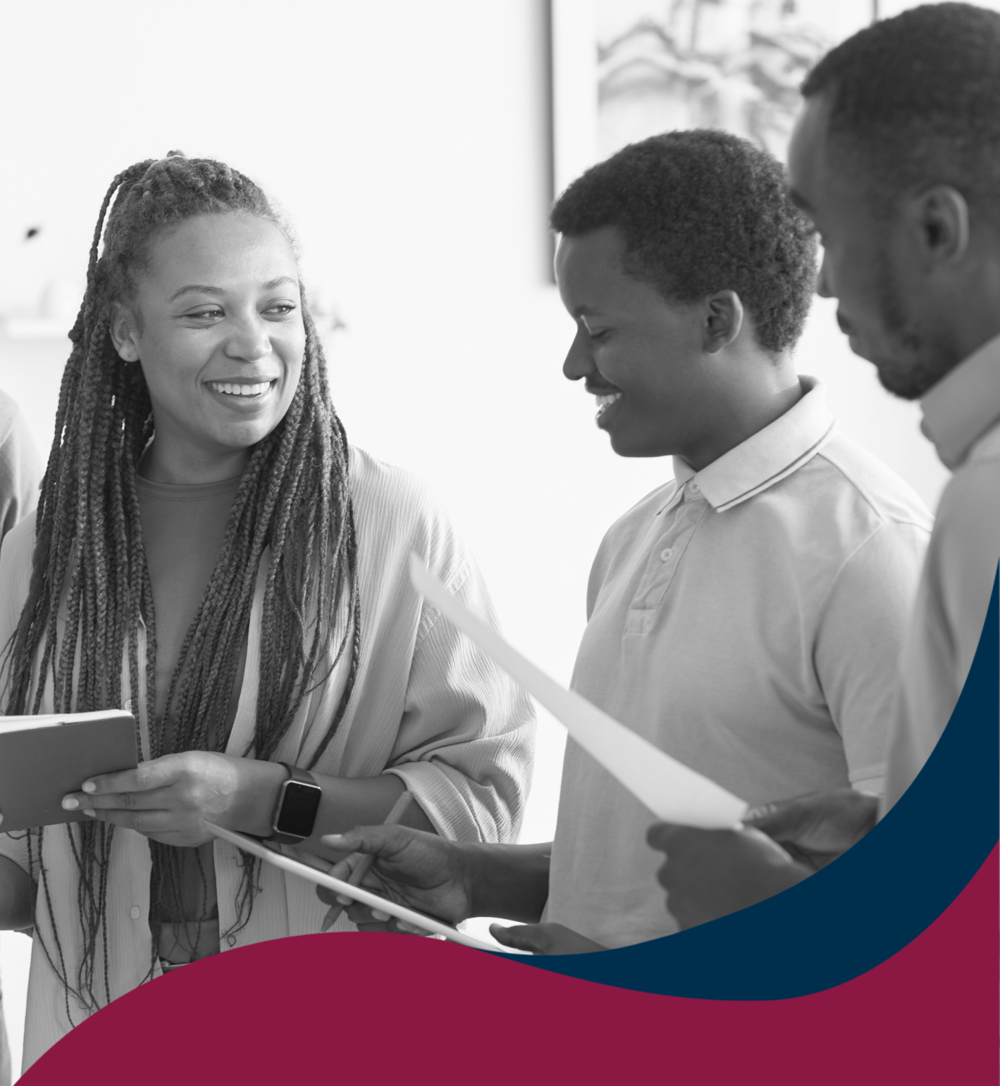 Diverse team discussing documents in a professional setting.